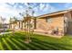 Well-maintained lawn with modern landscaping elements, enhancing the curb appeal of this home at 4410 E Boston Ave, Las Vegas, NV 89104