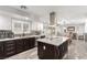 Spacious kitchen with an island and stainless steel appliances flows to dining area at 4410 E Boston Ave, Las Vegas, NV 89104