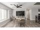 Bright living room offering tile floors, modern furniture, large TV, and seamless flow to other areas at 4410 E Boston Ave, Las Vegas, NV 89104