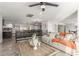 Spacious living room with open layout, tile flooring, and comfortable seating connected to dining and kitchen at 4410 E Boston Ave, Las Vegas, NV 89104
