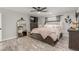 Inviting main bedroom features wood-look floors and ceiling fan at 4410 E Boston Ave, Las Vegas, NV 89104
