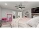 This main bedroom offers a ceiling fan and ensuite bath at 4410 E Boston Ave, Las Vegas, NV 89104