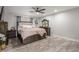 Relaxing main bedroom with a ceiling fan and wood-look flooring at 4410 E Boston Ave, Las Vegas, NV 89104