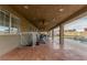 Spacious covered patio featuring an outdoor seating area and overlooking the refreshing pool at 4410 E Boston Ave, Las Vegas, NV 89104
