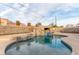 Backyard pool with a stone grotto feature providing a tranquil and picturesque setting at 4410 E Boston Ave, Las Vegas, NV 89104