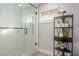Modern tiled walk-in shower next to rustic corner shelf at 4410 E Boston Ave, Las Vegas, NV 89104