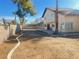 Large backyard with block wall and a grassy area at 4684 Trevins Ave, Las Vegas, NV 89103