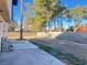 Large backyard with block wall and small patio at 4684 Trevins Ave, Las Vegas, NV 89103