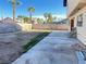 Backyard with patio, grassy area, and block wall at 4684 Trevins Ave, Las Vegas, NV 89103