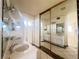 Double sink bathroom with mirrored sliding doors at 4684 Trevins Ave, Las Vegas, NV 89103