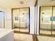 Bathroom with double vanity and mirrored sliding doors at 4684 Trevins Ave, Las Vegas, NV 89103