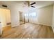 Bright bedroom with mirrored closet doors and wood-look floors at 4684 Trevins Ave, Las Vegas, NV 89103