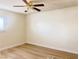 Simple bedroom with light walls and wood-look floors at 4684 Trevins Ave, Las Vegas, NV 89103