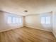 Bedroom with wood-look floors and window with shutters at 4684 Trevins Ave, Las Vegas, NV 89103