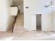 Bright entryway with tiled floors and staircase leading to upper level at 4684 Trevins Ave, Las Vegas, NV 89103