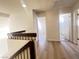 Upstairs hallway with light wood-look floors at 4684 Trevins Ave, Las Vegas, NV 89103