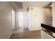 Upstairs hallway with light wood-look floors and doors to bedrooms at 4684 Trevins Ave, Las Vegas, NV 89103