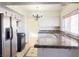 Galley kitchen with granite counters and stainless steel appliances at 4684 Trevins Ave, Las Vegas, NV 89103