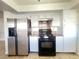 Kitchen features stainless steel appliances and granite countertops at 4684 Trevins Ave, Las Vegas, NV 89103