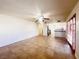 Bright living room featuring tile floors and a view into the kitchen at 4684 Trevins Ave, Las Vegas, NV 89103