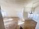Spacious living room with a chandelier and wood-look floors at 4684 Trevins Ave, Las Vegas, NV 89103