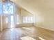 High-ceiling living room with hardwood floors and large windows at 4684 Trevins Ave, Las Vegas, NV 89103