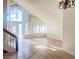 High-ceiling living room with hardwood floors and large windows at 4684 Trevins Ave, Las Vegas, NV 89103