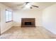Living room with a brick fireplace and tile floors at 4684 Trevins Ave, Las Vegas, NV 89103