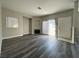 Bright living room featuring a fireplace and wood-look floors at 4730 E Craig Rd # 1100, Las Vegas, NV 89115