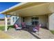 Inviting covered patio featuring comfortable seating, ideal for relaxation and outdoor entertaining at 4801 Westmont Dr, Pahrump, NV 89061