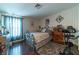 Bedroom with floral bedding and exercise bike at 5261 Lindell Rd # 205, Las Vegas, NV 89118