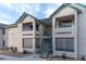 Two-story building exterior with teal accents and stairs at 5261 Lindell Rd # 205, Las Vegas, NV 89118