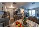Kitchen with gray cabinets, breakfast bar, and appliances at 5261 Lindell Rd # 205, Las Vegas, NV 89118