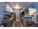Gray and white kitchen with appliances and breakfast bar at 5261 Lindell Rd # 205, Las Vegas, NV 89118