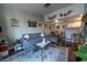 Open concept living room and kitchen with gray sofa at 5261 Lindell Rd # 205, Las Vegas, NV 89118