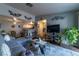 Spacious living room with gray sectional sofa and wood floors at 5261 Lindell Rd # 205, Las Vegas, NV 89118