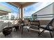 Small patio with table and chairs, overlooking a treed area at 5261 Lindell Rd # 205, Las Vegas, NV 89118