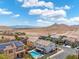 Community view showcasing homes, a pool, and desert landscape at 5310 Esparon Ave, Las Vegas, NV 89141