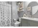 Charming bathroom with updated vanity, shower, and patterned shower curtain at 5310 Esparon Ave, Las Vegas, NV 89141