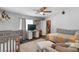 Spacious bedroom with a large bed, plenty of closet space, and a ceiling fan at 5310 Esparon Ave, Las Vegas, NV 89141