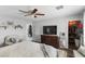 Cozy bedroom with a large bed, walk-in closet and ceiling fan at 5310 Esparon Ave, Las Vegas, NV 89141