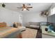 Bright bedroom featuring two cribs, a daybed, and ample natural light at 5310 Esparon Ave, Las Vegas, NV 89141