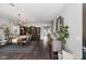 Elegant dining room with a large table, chandelier, and hardwood floors at 5310 Esparon Ave, Las Vegas, NV 89141