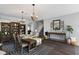 Bright dining room features a large table, chandelier and hardwood floors at 5310 Esparon Ave, Las Vegas, NV 89141