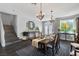 Spacious dining area with hardwood floors and a staircase at 5310 Esparon Ave, Las Vegas, NV 89141
