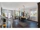 Open concept dining room with hardwood floors and entryway view at 5310 Esparon Ave, Las Vegas, NV 89141