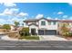 Two-story house with a two-car garage and neatly landscaped yard at 5310 Esparon Ave, Las Vegas, NV 89141