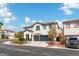 Two-story house with a two-car garage and landscaped front yard at 5310 Esparon Ave, Las Vegas, NV 89141