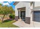 Inviting front entrance with a modern door and landscaping at 5310 Esparon Ave, Las Vegas, NV 89141