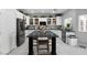Modern kitchen with white cabinets, large island, and stainless steel appliances at 5310 Esparon Ave, Las Vegas, NV 89141